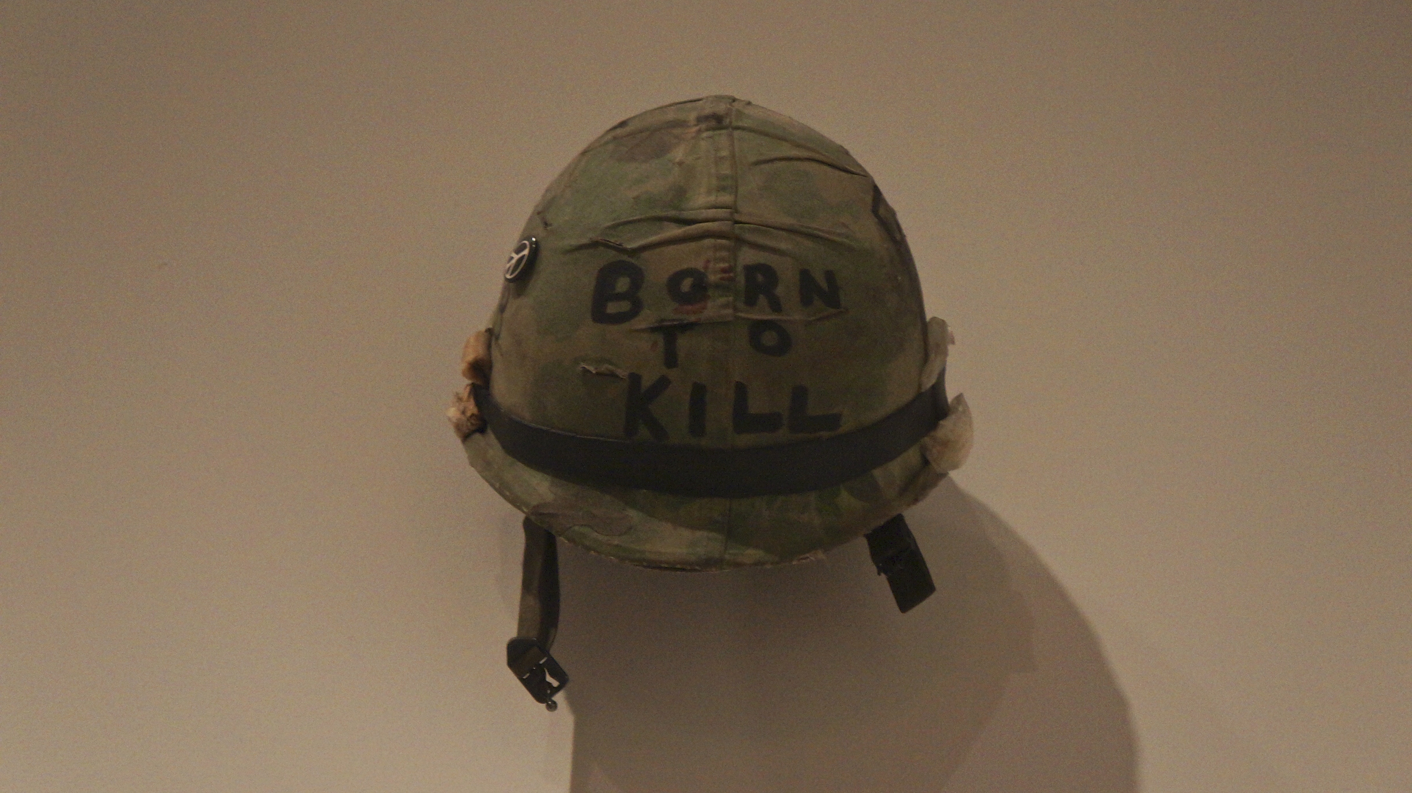 Stanley_Kubrick_The_Exhibition_-_LACMA_-_Full_Metal_Jacket_-_Joker's_helmet_(8998516647)